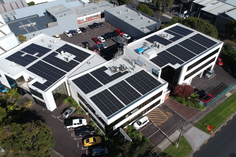 The SiteHost building, seen from air, with over 300 solar panels on the roof.