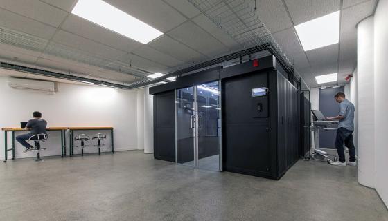 Two SiteHost team members working near the data centre.